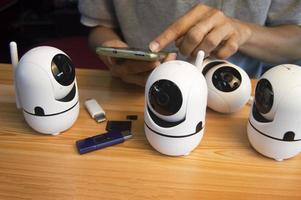 Conceptual man operating ip camera photo