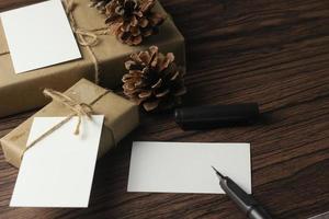 A birthday gift box wrapped in recycled paper is being prepared on the table. photo