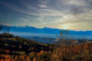 the colors of the Langhe in autumn in Serralunga D'Alba, with the vineyards and hills that are colored with warm colors like the autumn season photo