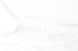 White crumpled cloth with the soft wave and  wrinkled texture background. photo
