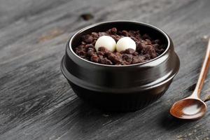 Patjuk, Korean Red Bean Porridge with Rice Cake on Top. photo