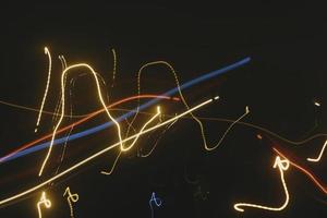 Long Exposure Photograph Of Vehicle Lights At Night In City photo