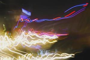 Long Exposure Photograph Of Vehicle Lights At Night In City photo