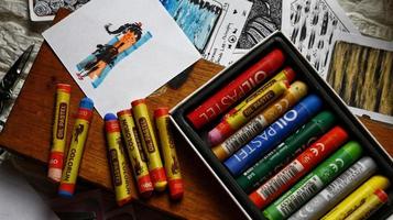 View Of Desk From Above With Arts Supplies On It photo