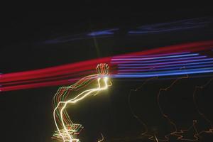 Long Exposure Photograph Of Vehicle Lights At Night In City photo