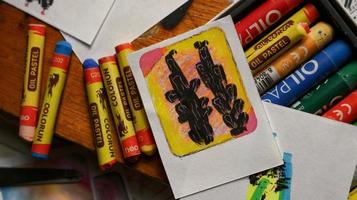 View Of Desk From Above With Arts Supplies On It photo