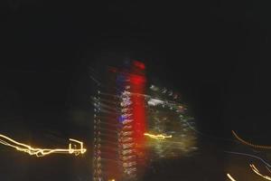 Long Exposure Photograph Of Vehicle Lights At Night In City photo