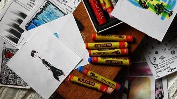 View Of Desk From Above With Arts Supplies On It photo