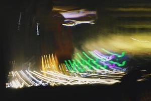 Long Exposure Photograph Of Vehicle Lights At Night In City photo