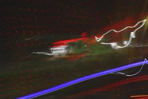 Long Exposure Photograph Of Vehicle Lights At Night In City photo