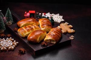 Sweet tasty fresh festive baking on a dark concrete background photo