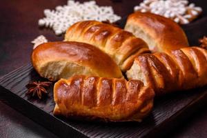 Sweet tasty fresh festive baking on a dark concrete background photo