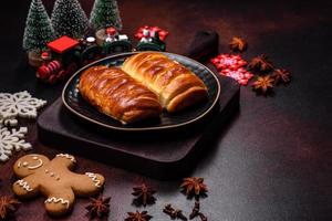 Sweet tasty fresh festive baking on a dark concrete background photo