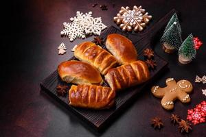 Sweet tasty fresh festive baking on a dark concrete background photo