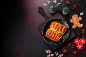 Sweet tasty fresh festive baking on a dark concrete background photo