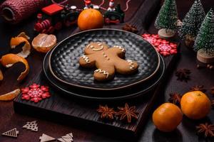 Beautiful Christmas decorations with holiday toys, clementines and gingerbread photo