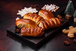 Sweet tasty fresh festive baking on a dark concrete background photo