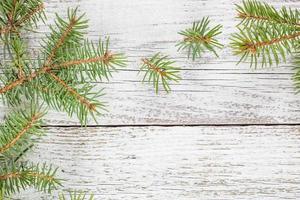 Christmas wooden background with fir tree. Top view copy space photo