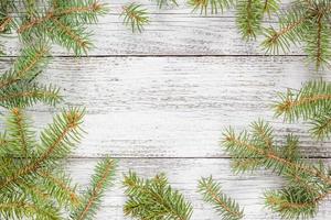 Christmas wooden background with fir tree. Top view copy space photo