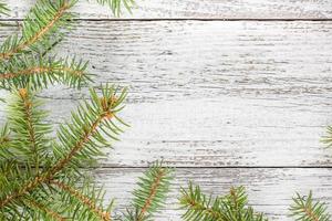 Christmas wooden background with fir tree. Top view copy space photo