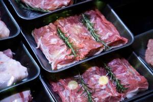 raw meat on the bench in the store photo