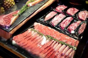 raw meat on the bench in the store photo