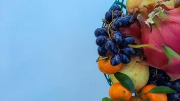 Flat lay, Tropical Dragon Fruit Oranges, pears, grapes on white background 04 photo