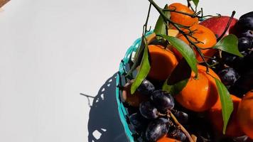 Close up, Tropical fruit in green basket on white background 01 photo