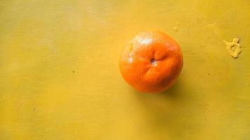 Top angle, Orange fruit on a yellow background 01 photo