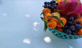 Tropical Dragon Fruit Oranges, pears, grapes on the right on a white background 01 photo