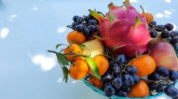 Tropical Dragon Fruit Orange, pear, grape isolated on white background photo