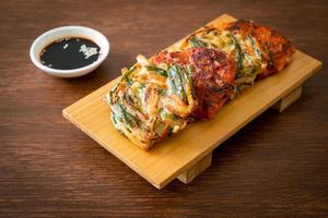 Pajeon or Korean pancake and Korean Kimchi pancake or Kimchijeon on white background photo
