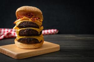 hamburger or beef burgers with cheese, bacon and french fries photo