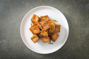 fried tofu with white sesame and teriyaki sauce photo
