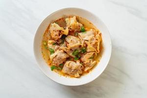 pork wonton soup or pork dumplings soup with roasted chili photo