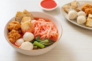 small flat rice noodles with fish balls and shrimp balls in pink soup, Yen Ta Four or Yen Ta Fo photo