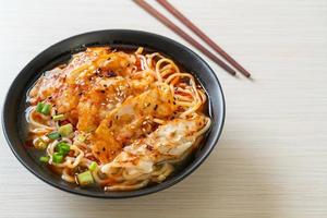 ramen noodles with gyoza or pork dumplings photo