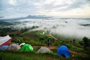 Phetchaboon, Thailand - June 23, 2018 Camping  tent near the fog and mountain seeing sunrise in the moring, Thailand