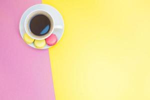 Flat lay of coffee cup with macaroons photo