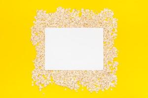 Top view of oatmeal flakes in minimal style photo