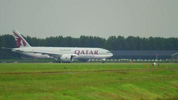 AMSTERDAM, THE NETHERLANDS JULY 24, 2017 - Qatar Cargo Boeing 777 A7 BFL taxiing before departure at Polderbaan 36L, rainy weather, Shiphol Airport, Amsterdam, Holland video