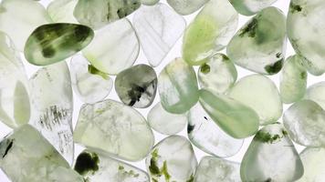 Prehnite heap up jewel texture on white light background. Moving right seamless loop backdrop. video