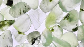 Prehnite heap up jewel texture on white light background. Moving right seamless loop backdrop. video