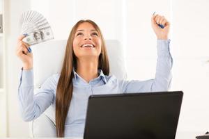 Successful  Businesswoman holding cash photo