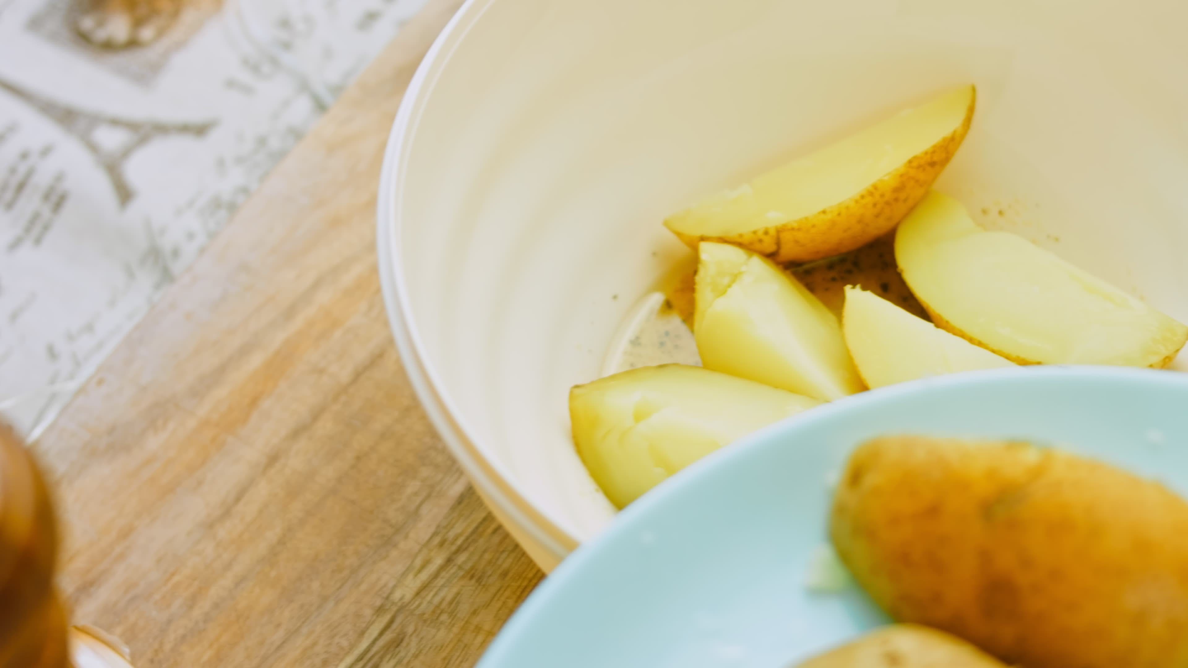 Boil the potatoes in an iron bowl. Macro shooting on intense steam