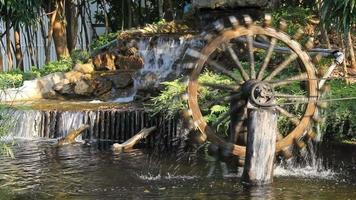 waterwheel wooden with artificial waterfall video