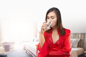 Women drinking water in the morning photo