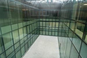 Glass office room with panoramic windows. Unused, free space, prepared for meditative garden. Modern business center photo