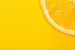 Fresh juicy fruit, orange, yellow background, copy space photo