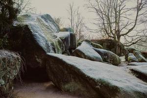 huge round frozen stones  in winter park photo